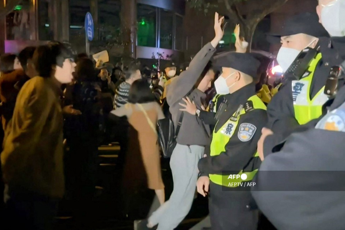 Foto: AFP | La televisión china censura imágenes de gente sin mascarilla en Mundial de fútbol